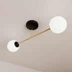 Plafondlamp gepoedercoat staal en glas Magnum 2 lichts, zwart goud met witte glazen kappen, 55 cm breed