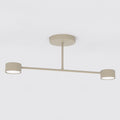 Beige plafondlamp met horizontale arm en twee ronde lichtpunten aan een ronde plafondplaat
