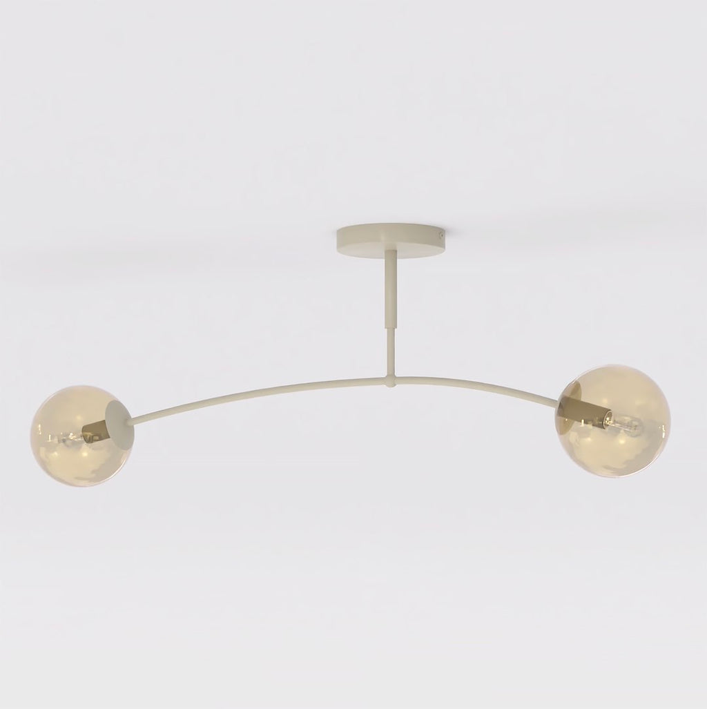 Beige plafondlamp met gebogen frame en twee amberkleurige glazen bollen