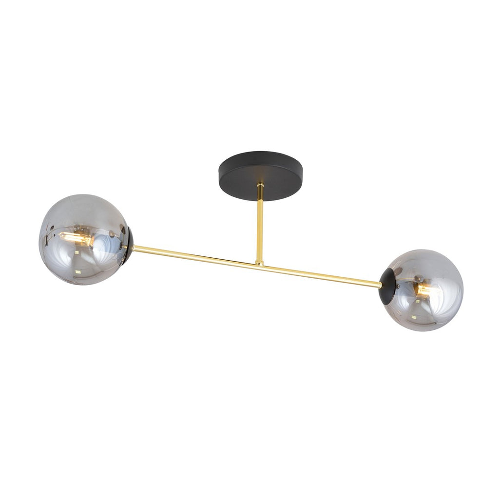 Plafondlamp met twee grijze glazen bollen aan een gouden arm en een zwarte plafondplaat