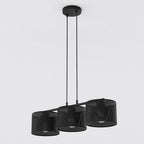 Zwarte hanglamp met drie geperforeerde cilindrische kappen aan een smalle balk, opgehangen aan twee dunne stangen