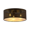 Ronde zwarte plafondlamp met perforatiepatroon en gouden binnenkant, brandend met warm licht
