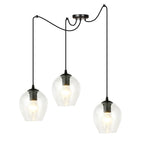 Zwarte hanglamp met drie transparante glazen kappen aan lange zwarte kabels en een ronde plafondplaat