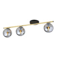 Plafondlamp met gouden buis, zwarte plafondplaat en drie grafietkleurige glazen bollen op een rij