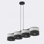 Hanglamp met vier cilindrische kappen op een rij, grijs stof boven en zwart geperforeerd onder, aan twee dunne stangen