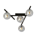 Zwarte plafondlamp met vier grafietkleurige glazen bollen op een open stalen frame