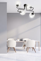 Plafondlamp gepoedercoat staal en glas Brendi 4 lichts, zwart met transparante glazen kappen, 55 x 32 cm