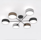 Zesarmige plafondlamp met zwart frame en cilindrische geweven kappen in zwart, bruin en grijs