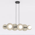 Hanglamp met mokkakleurige cirkelvormige schijven, witte bollen en zwart frame aan twee dunne ophangsnoeren