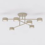 Beige plafondlamp met kruisarm-ontwerp en zes ronde kappen met wit lichtvlak aan de onderzijde