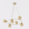 Beige ronde hanglamp met zes amberkleurige glazen bollen aan drie dunne ophangsnoeren