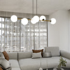 Hanglamp gepoedercoat staal en glas Gravity, zwart met goud en witte glazen kappen, 6 lichts, 110 cm breed