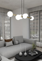 Hanglamp gepoedercoat staal en glas Gravity, zwart met goud en witte glazen kappen, 6 lichts, 110 cm breed