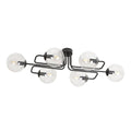 Zwarte plafondlamp met zes armen en zes transparante glazen bollen met zichtbare lichtbronnen