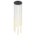 Hanglamp met zeven gouden buizen in verschillende lengtes aan zwarte snoeren onder een ronde zwarte canopy