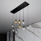 Hanglamp gepoedercoat staal en glas Cosmo zwart, 9 glazen kappen transparant, grafiet en amber, 104 x 120 cm