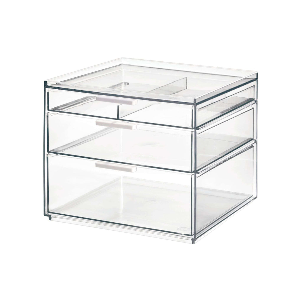 Transparante make-up organizer met drie lades met witte handgrepen en een tray bovenop