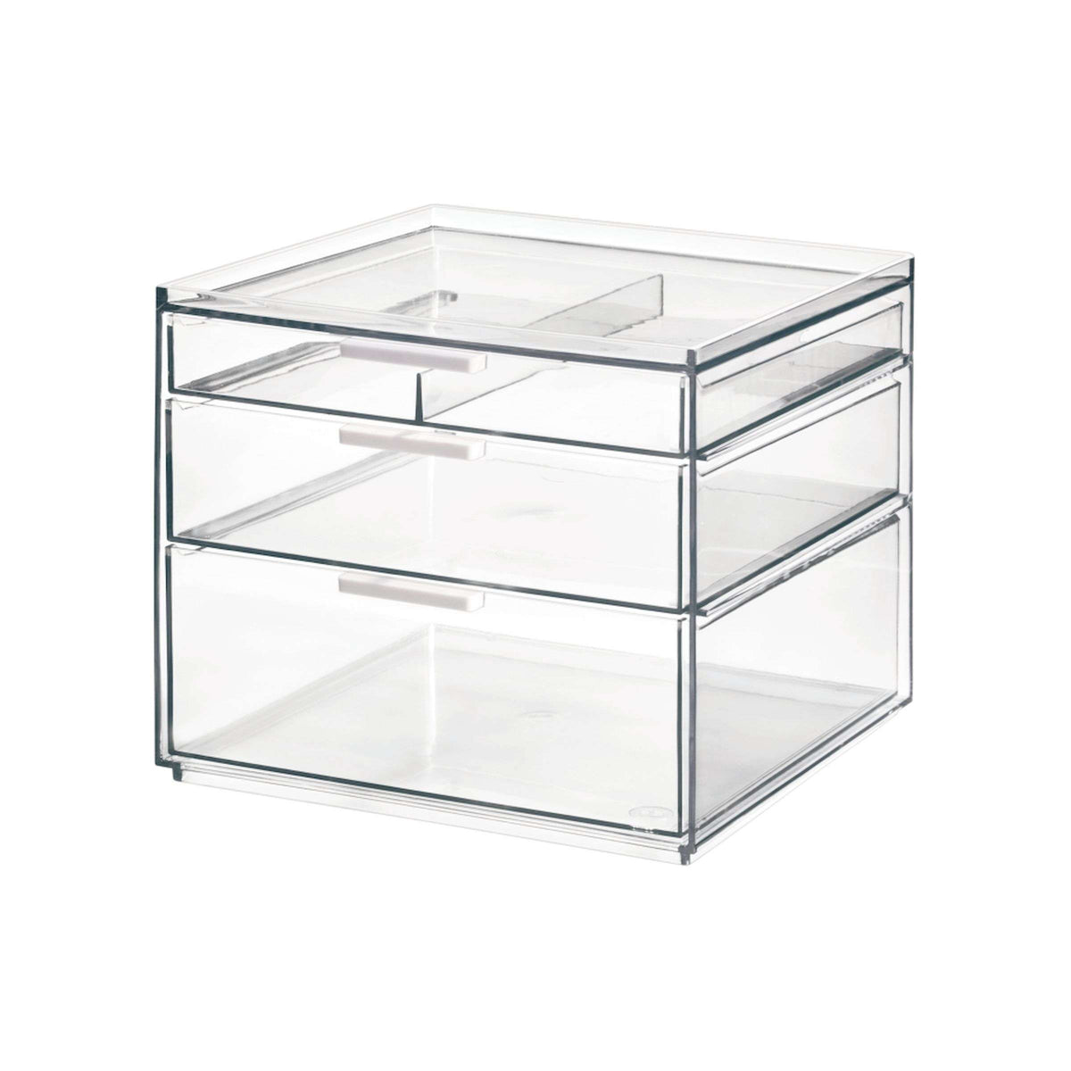 Transparante make-up organizer met drie lades met witte handgrepen en een tray bovenop