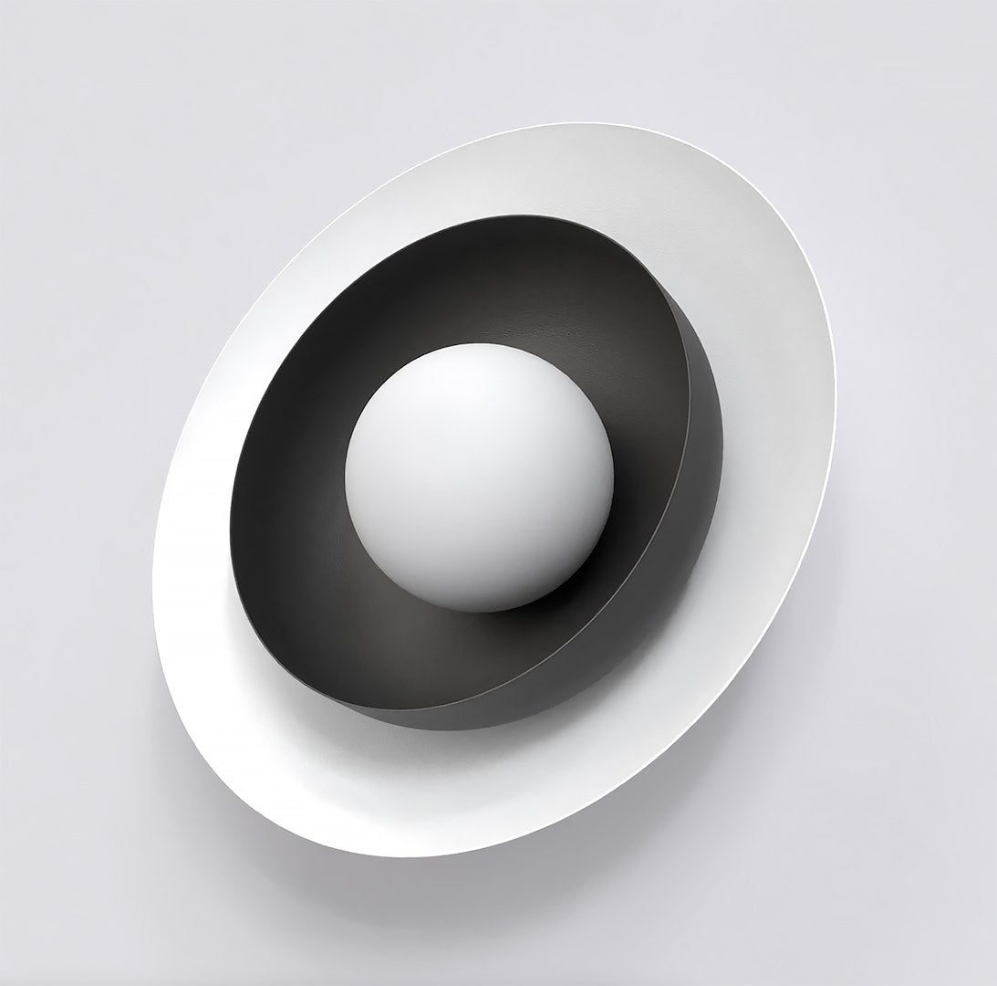 Ronde witte lampenkap in een zwarte ovale schaal met witte buitenste schijf, wandlamp Poppi